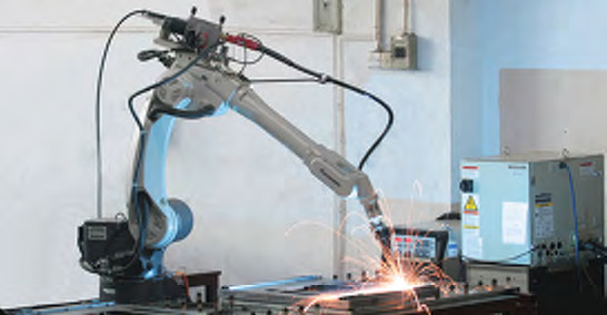 Robotic welding equipment shown in TOTEN manufacturing photographs